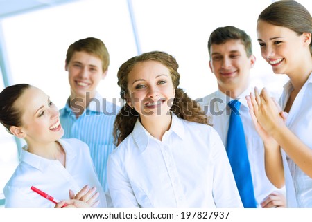 Successful business woman receiving congratulations from his colleagues, business success