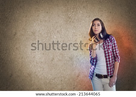 Young teenager girl in shirt wearing headphones