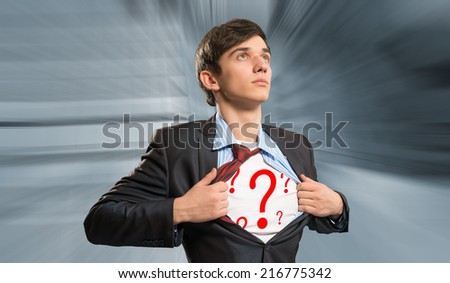 businessman breaks the shirt, under which the question marks behind the abstract background
