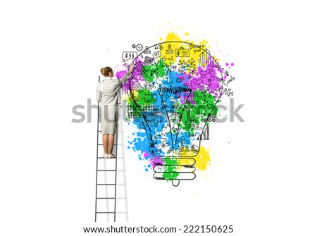Back view of businesswoman standing on ladder and drawing on wall