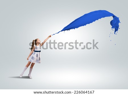 Cute girl in dress and colorful paint splash