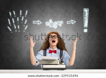 Young emotional girl writer using typing machine