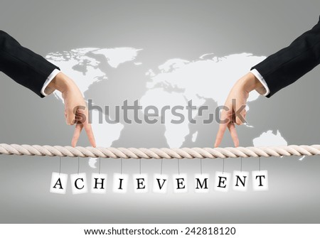 Close up of businessmen hands walking with fingers on rope