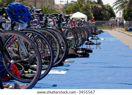 Group of Bikes\' wheels in a row  in a triathlon competition.