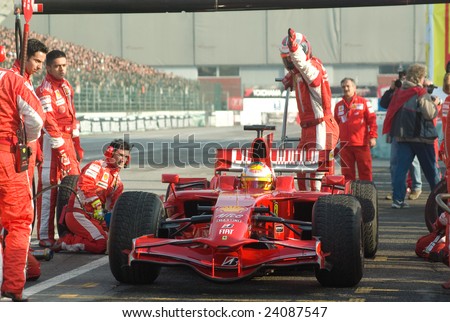 BOLOGNA,ITALY-06 DECEMBER 2008: Ferrari racing team simulate a classic pit stop at the 2008th edition of Motor Show in Bologna,Italy