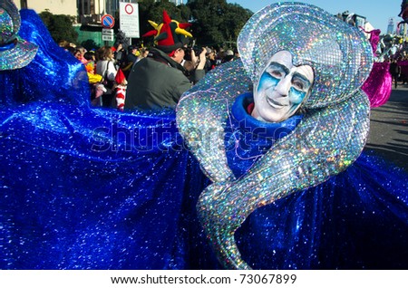 VIAREGGIO, ITALY - MARCH 8:  old man smiling in carnival mask, during the famous Carnival of Viareggio on march 8, 2011 in Viareggio, Italy