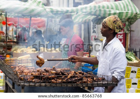 LONDON, ENGLAND - AUGUST 28: Food\'s stall at the Notting Hill Carnival on August 29, 2011 in London, England. Jerk Chicken Caribbean Specialty