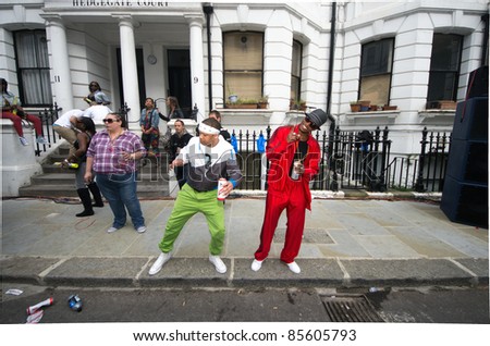 LONDON - AUG 29: two afro men dancing hip hop during the Notting Hill Carnival on August 29, 2011 in London, England.