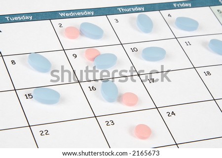 Pills on a calendar daily and weekly schedule