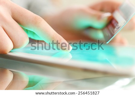 Woman is shopping online with tablet pc