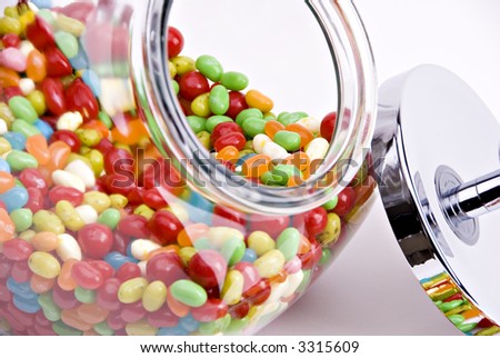 close-up of open jar of colorful jelly beans