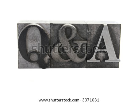 old letterpress metal type letters form the term \'Q&A\' isolated on white