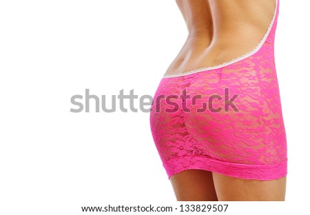 Lower rear area of the slender female body is dressed in the pink guipure. There is copy space.