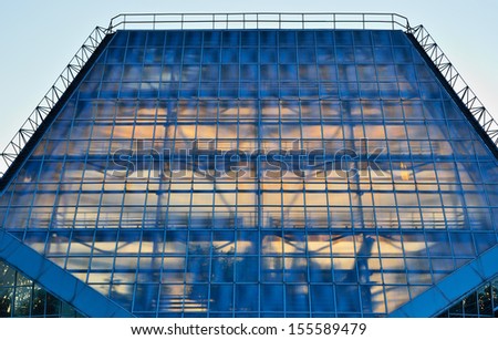 Glass roof with geometric pattern is illuminated from within.