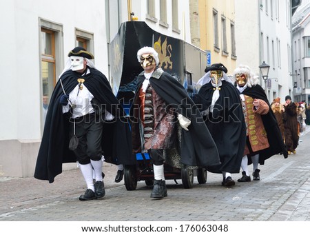 CONSTANCE, GERMANY - FEBRUARY 07 2013: Maskers in fancy dress walk in procession at the winter carnival Fastnacht in CONSTANCE, GERMANY - FEBRUARY 07 2013.