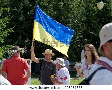 KYIV, UKRAINE - JULY 06 2014: Members and visitors are at the 11th International Ethnic Festival \