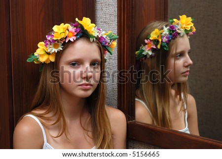 Young model had a flower diadem near mirror