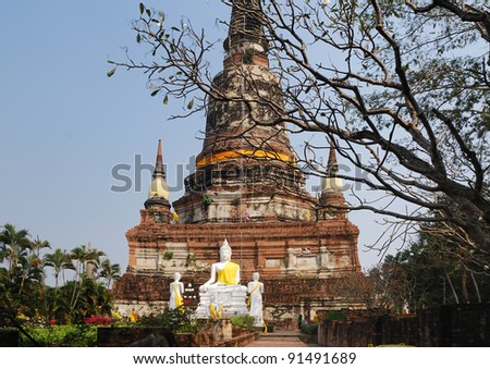 Ancient Wat Yai Chai Mongkol is active Buddhist shrine. It is one of the major temples in the Ayutthaya area. The sculpture Buddha is at the foot of a stupa.