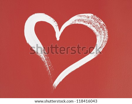 White heart painted on red background. Brush stroke texture.