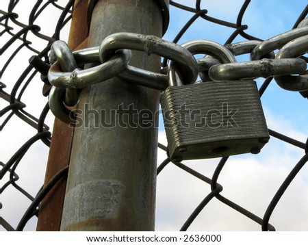 Lock, chains and chain link fence