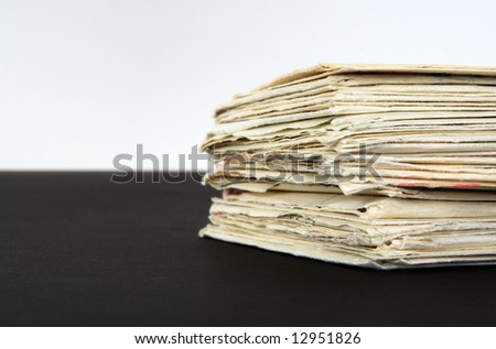 Stack of old letters on black and white background.