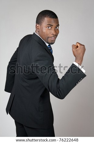 African American business man showing his strength.