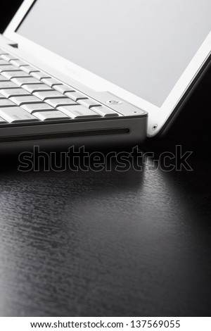 Open laptop on table with copyspace