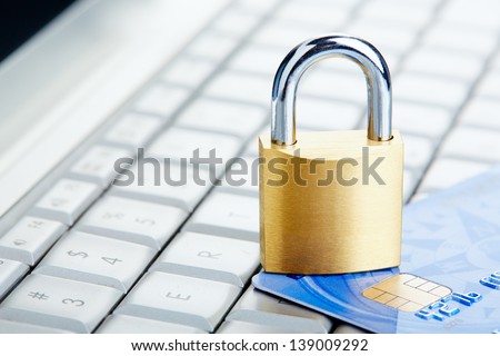 The padlock on a credit card lie on keyboard