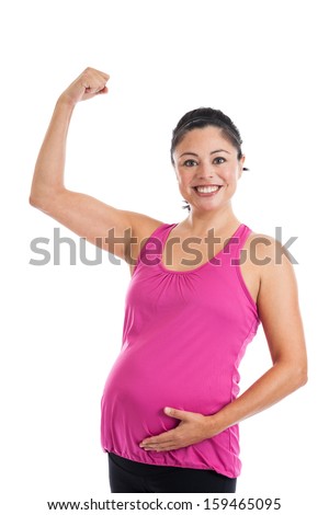 Beautiful fit Hispanic pregnant woman showing her toned bicep muscle isolated on white background