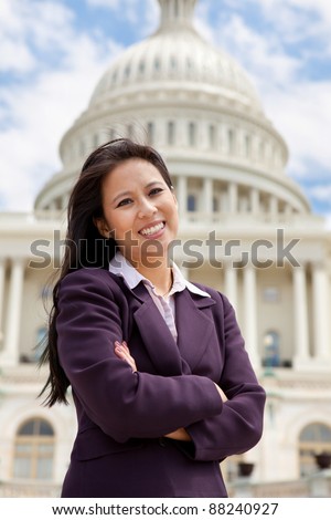 Asian professional woman in front of the US Capitol building in Washington DC
