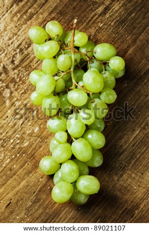 Bunch of grapes on a wooden table
