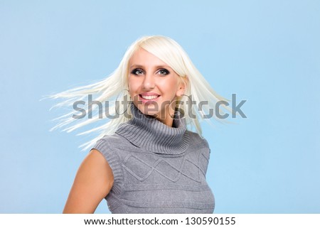smiling woman with flying hair