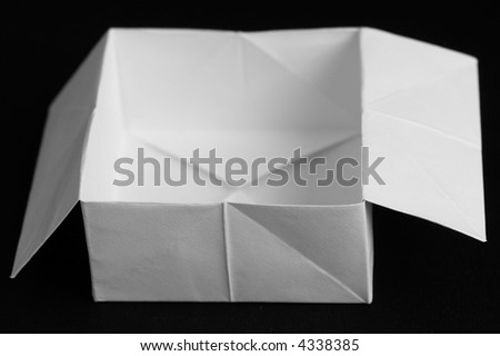 Paper box - simple origami on a black background