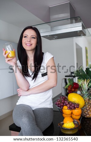 Beautiful woman drinking fresh orange juice