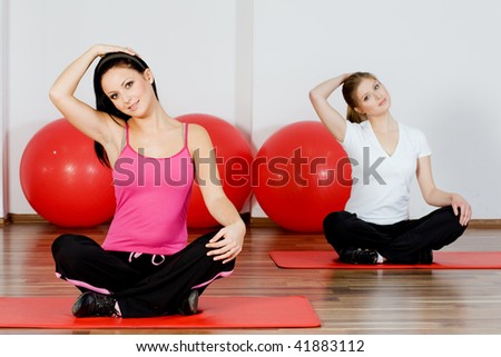 people doing yoga classes at the gym