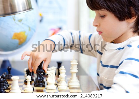 boy playing a game of chess, the development of logical thinking