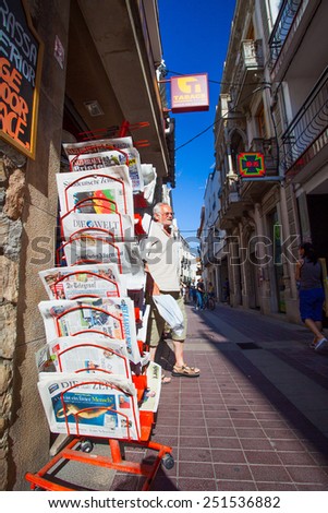 Catalonia, Spain, JUNE 15, 2013: rack with fresh newspaper on the street of Tossa de Mar town