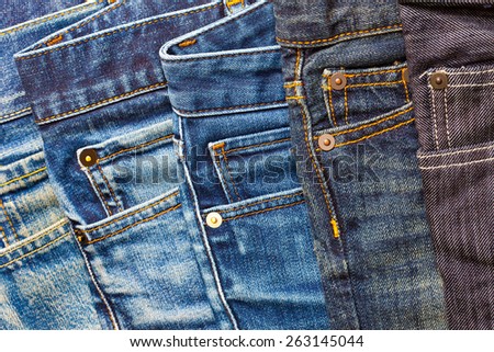 pile of blue and black jeans