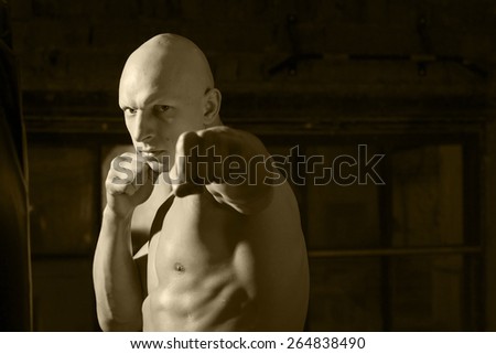 aggressive fighter monochrome portrait at the gym