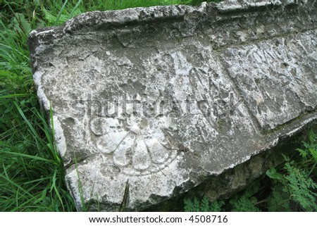 Texture, Vintage Old-time Stone with Drawing and Letter in Herb, Artifact