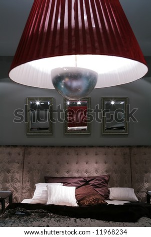 intimate semidarkness under luxurious bed with pillow