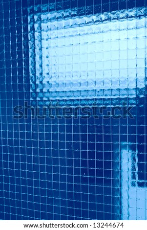 abstraction, blue plaid background from fine wire in glass