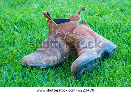 Battered Old Work Boots on Lawn