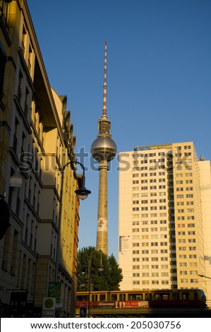 Berlin, Germany, May 17, 2009: a train passing by Hakesches-Markt station in Mitte, with the TV tower at the background