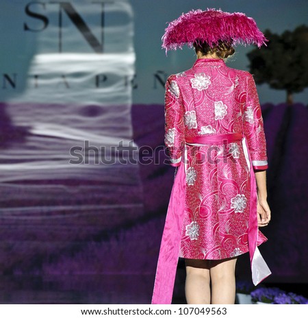 BARCELONA - MAY 11: A model walks on the Sonia Pena catwalk during the Barcelona Bridal Week runway on May 11, 2012 in Barcelona, Spain.