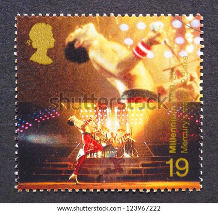 UNITED KINGDOM Ã¢Â?Â? CIRCA 1999: postage stamp printed in United Kingdom showing an image of Freddie Mercury from Queen band, circa 1999.