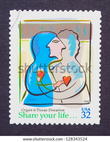 UNITED STATES Ã¢Â?Â? CIRCA 1998: a postage stamp printed in USA showing an image that promotes organ and tissue donation, circa 1998.