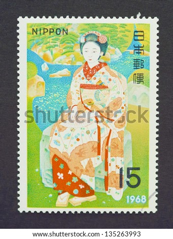 JAPAN - CIRCA 1968: a postage stamp printed in Japan showing an image of a japanese woman wearing a traditional dress, circa 1968.
