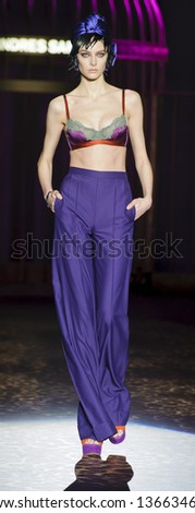 MADRID - FEBRUARY 18: A model walks on the Andres Sarda catwalk during the Cibeles Madrid Fashion Week runway on February 18, 2013 in Madrid.