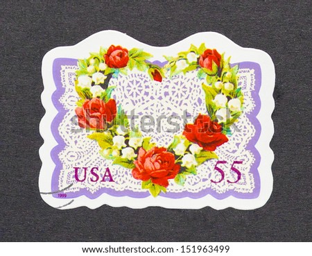 UNITED STATES - CIRCA 1999: a postage stamp printed in United States showing an image of a heart made with flowers, circa 1999.
